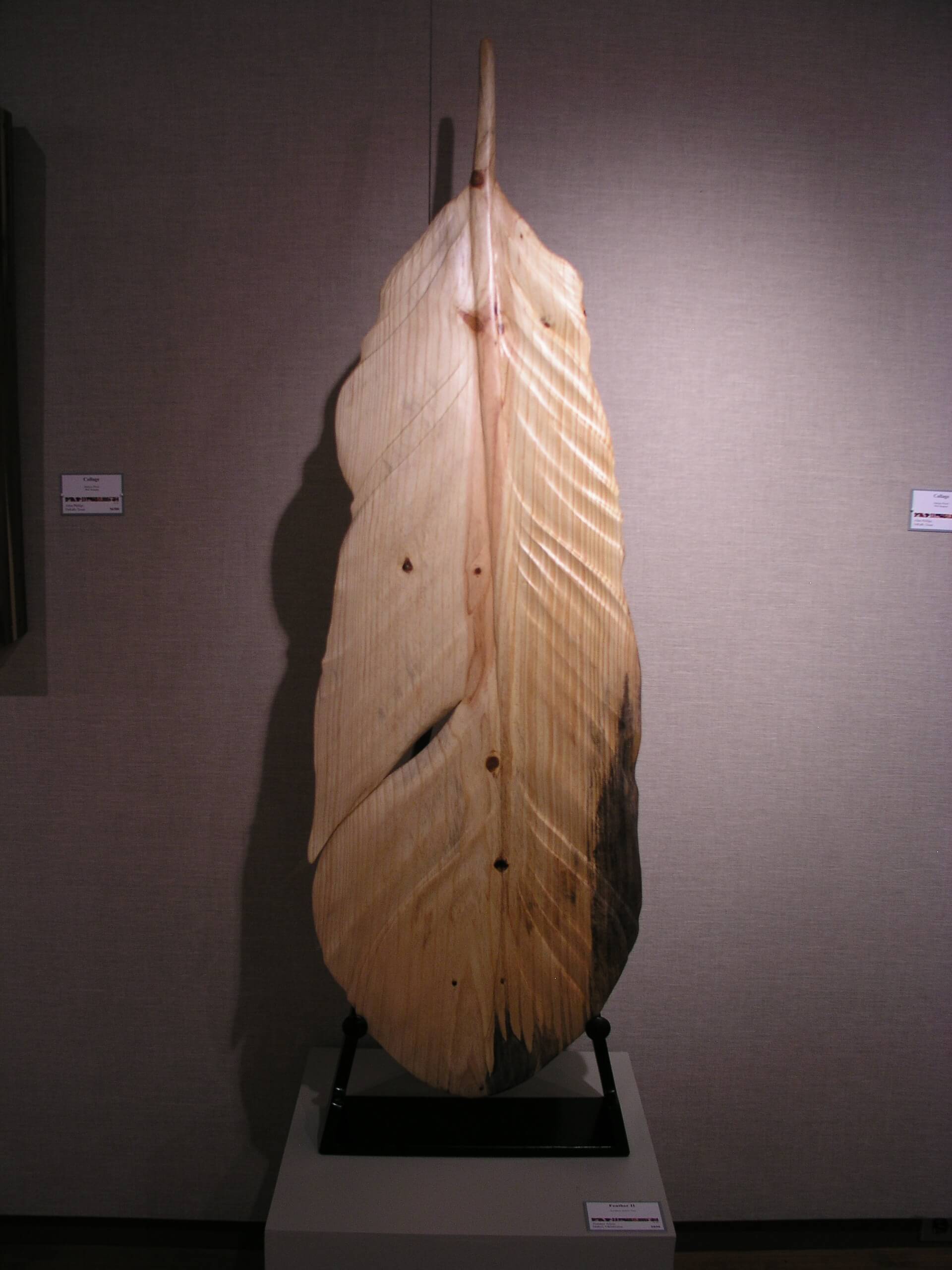 Wooden feather carved sculpture.