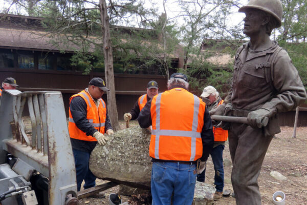 Positioning the engraved stone at the Wildland Firefighter Memorial